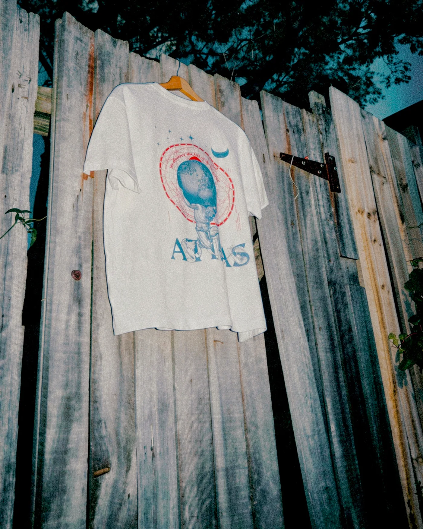 Atlas, hung on a fence at dusk